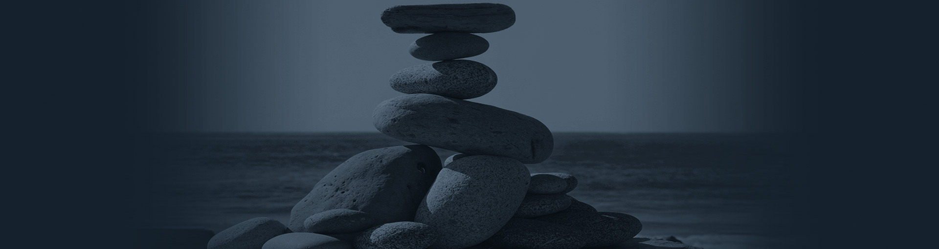 Beach pebbles balancing on top of each other